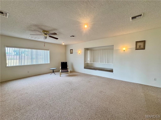 unfurnished room featuring visible vents and carpet floors