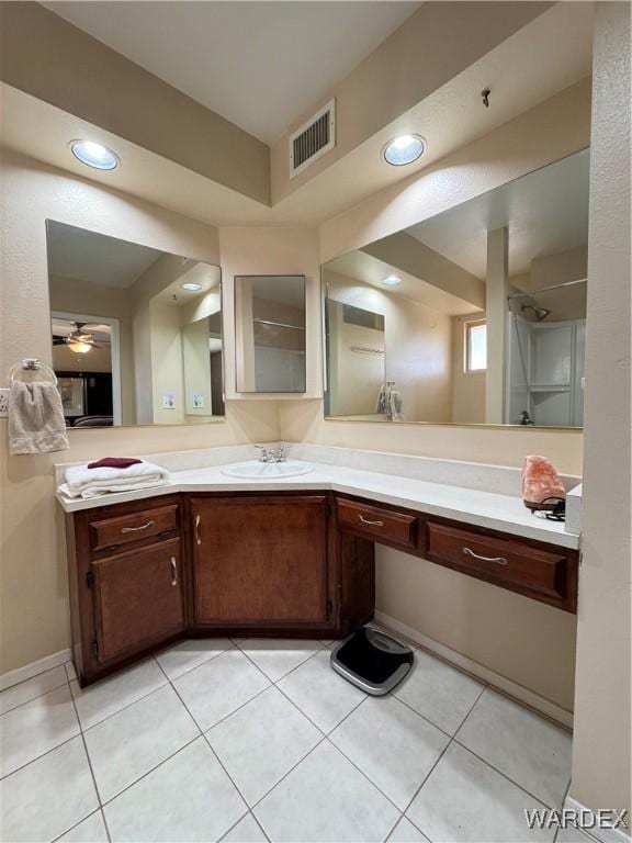 bathroom with vanity, visible vents, recessed lighting, a shower, and tile patterned floors