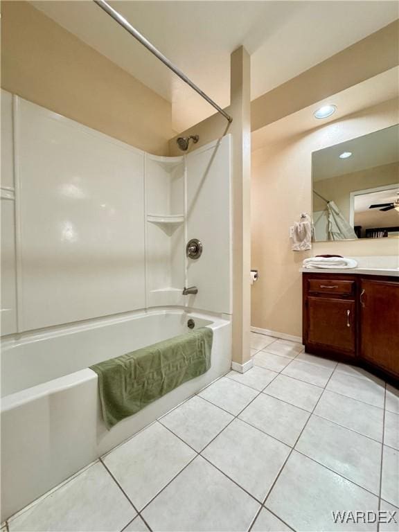 bathroom with vanity, tile patterned floors, bathing tub / shower combination, and baseboards