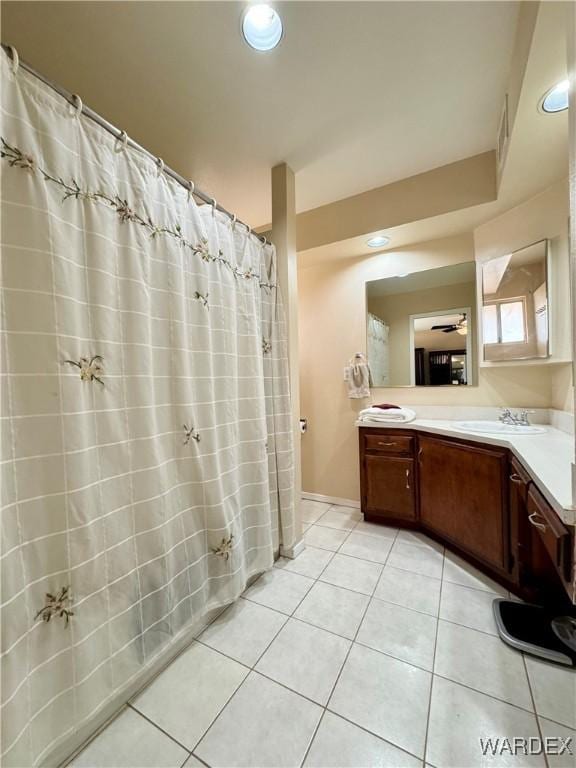 bathroom with tile patterned floors, curtained shower, recessed lighting, and vanity