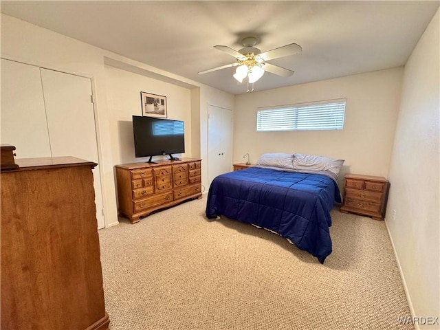 carpeted bedroom with baseboards and ceiling fan