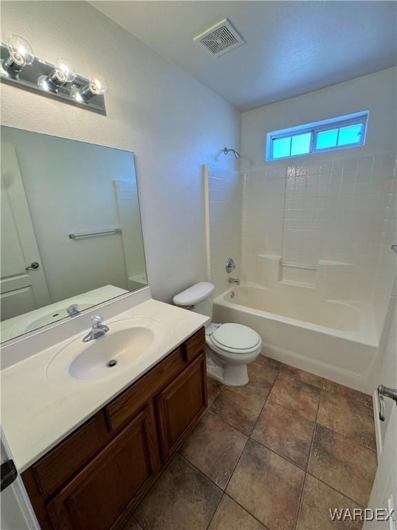bathroom with toilet, visible vents, shower / bathing tub combination, and vanity
