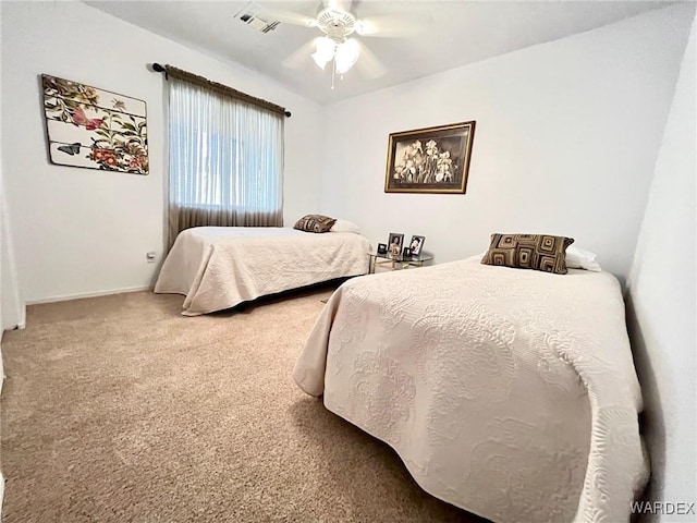 bedroom with ceiling fan, carpet, visible vents, and baseboards