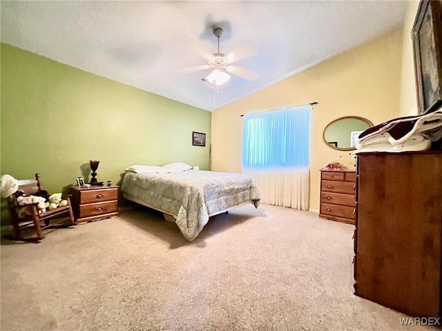 bedroom featuring lofted ceiling, ceiling fan, and light carpet