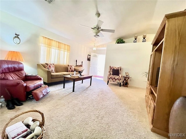 living room with light carpet, vaulted ceiling, and ceiling fan