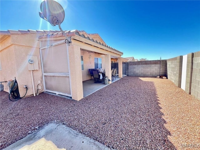 view of yard with a patio and a fenced backyard