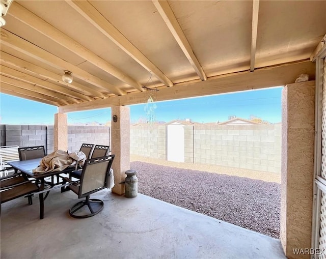 view of patio featuring outdoor dining area and a fenced backyard