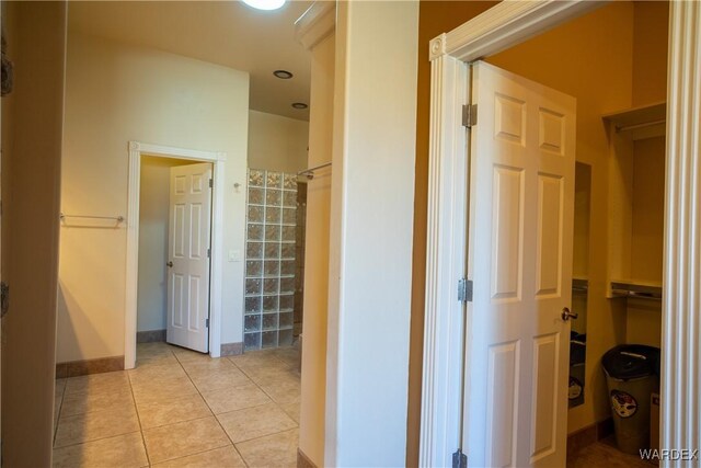 bathroom featuring tile patterned flooring and baseboards