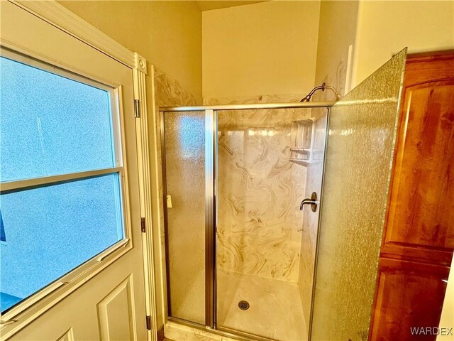 bathroom featuring a shower stall