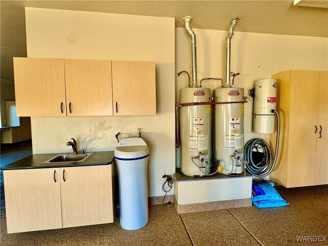 utilities featuring a sink and gas water heater