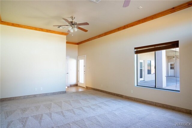 unfurnished room with ceiling fan, crown molding, and light colored carpet