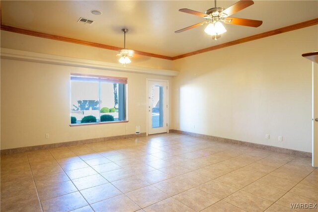 spare room featuring baseboards, visible vents, ceiling fan, crown molding, and light tile patterned flooring