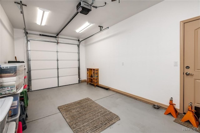 garage featuring a garage door opener