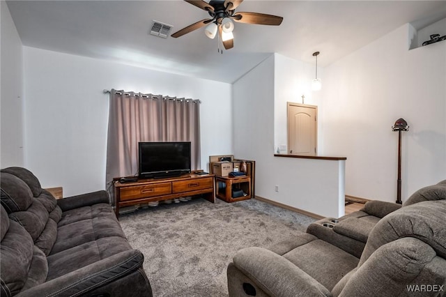 living room with carpet, visible vents, a ceiling fan, and baseboards