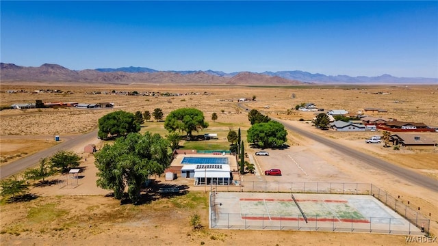 birds eye view of property featuring a mountain view, a rural view, and a desert view