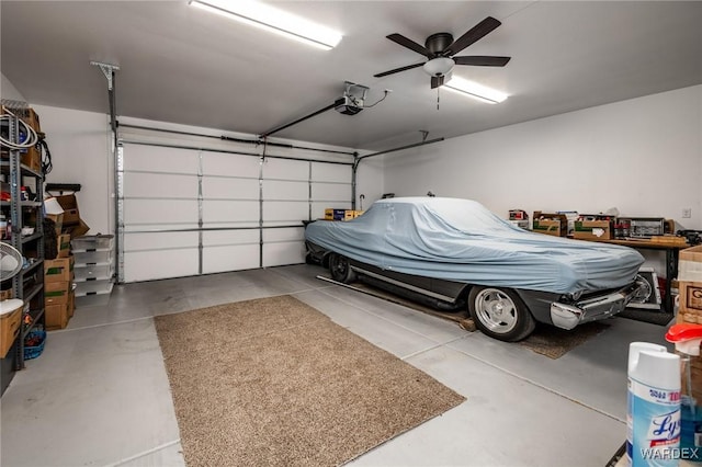 garage with a garage door opener and a ceiling fan