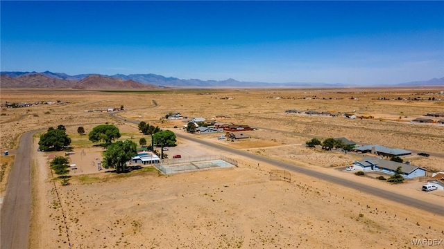birds eye view of property featuring a rural view, a mountain view, and a desert view
