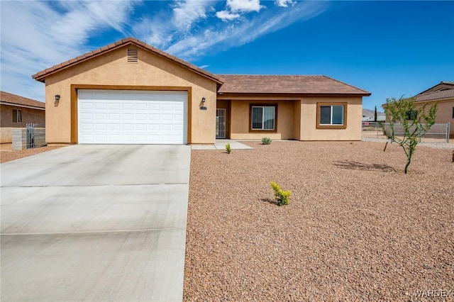 single story home with a garage, fence, stucco siding, and driveway