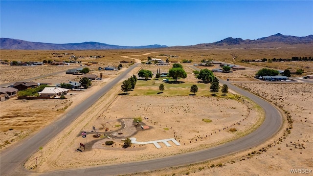 birds eye view of property with a rural view, view of desert, and a mountain view
