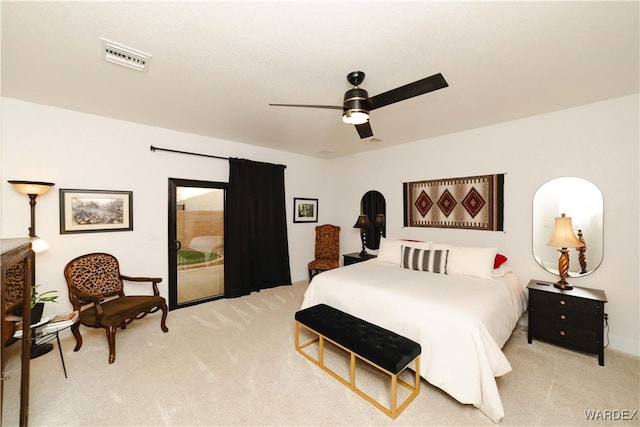 bedroom featuring light carpet, ceiling fan, and visible vents