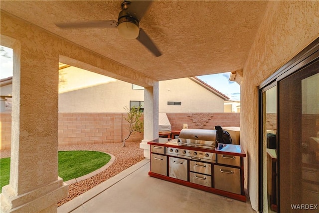 view of patio / terrace with an outdoor kitchen, a fenced backyard, a grill, visible vents, and a ceiling fan