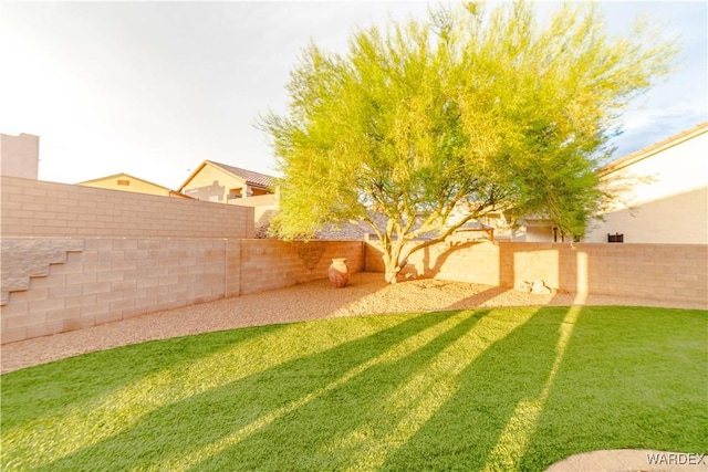 view of yard with a fenced backyard