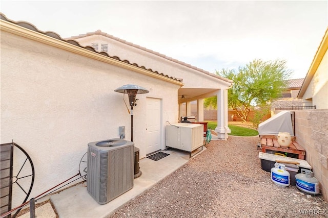 view of patio with a fenced backyard and cooling unit