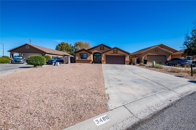 view of front facade featuring driveway and an attached garage