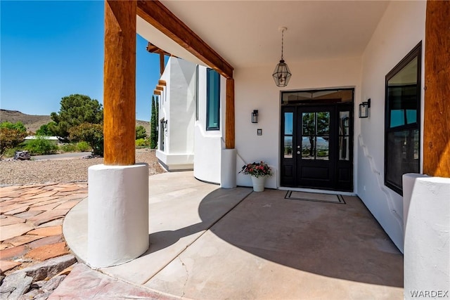 property entrance featuring stucco siding