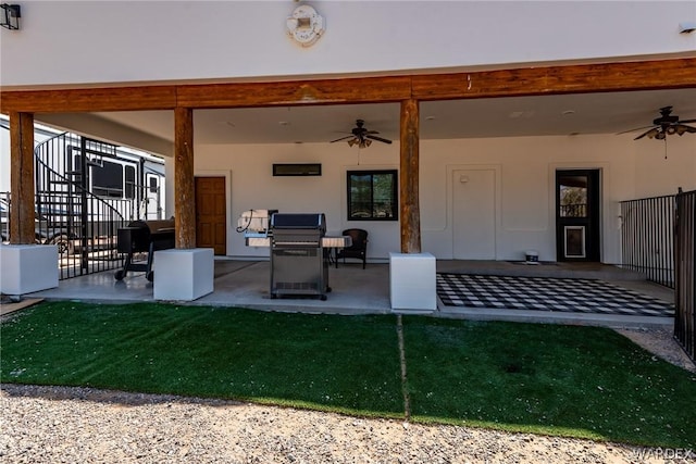 view of patio / terrace featuring a ceiling fan and stairs