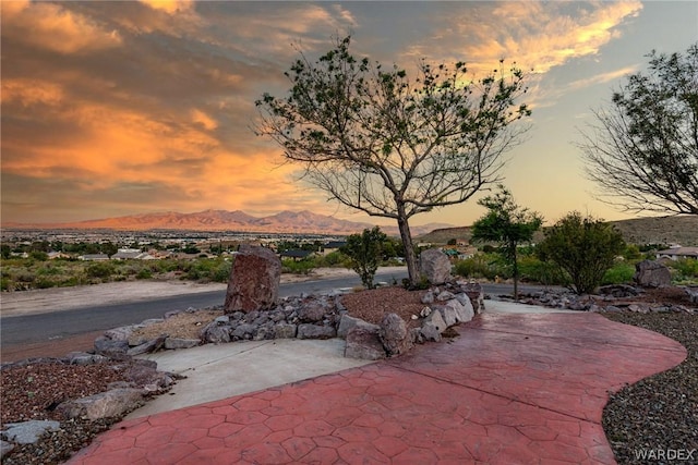 patio terrace at dusk with a mountain view