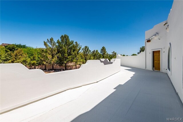 view of patio / terrace featuring fence