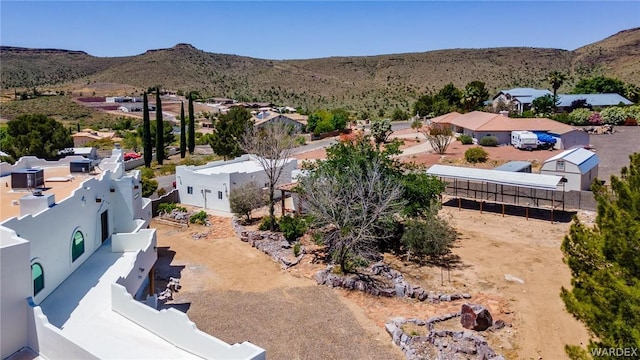 drone / aerial view featuring a residential view and a mountain view