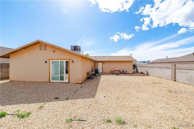 3144 N Prescott St, Kingman, AZ 86401 - back of property featuring stucco siding, cooling unit, and a fenced backyard