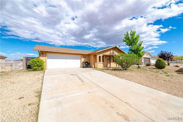 3144 N Prescott St, Kingman, AZ 86401 - single story home with an attached garage, driveway, stucco siding, and fence