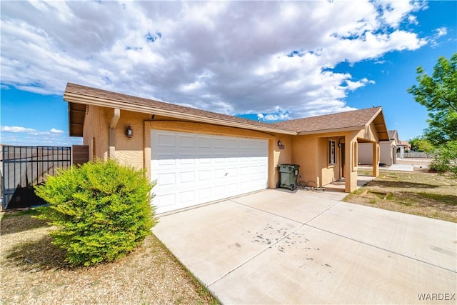 3144 N Prescott St, Kingman, AZ 86401 - single story home featuring an attached garage, concrete driveway, fence, and stucco siding