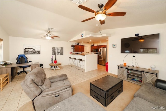 3144 N Prescott St, Kingman, AZ 86401 - living room with a ceiling fan, visible vents, vaulted ceiling, and light tile patterned floors