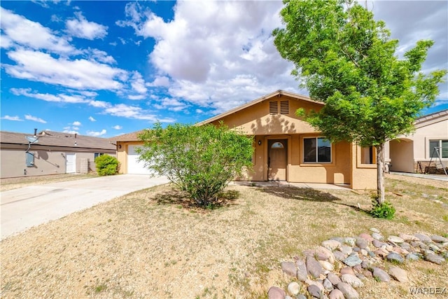 3144 N Prescott St, Kingman, AZ 86401 - ranch-style house with an attached garage, concrete driveway, and stucco siding