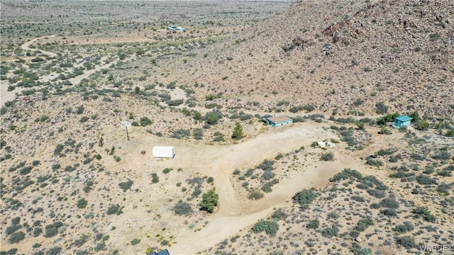 birds eye view of property featuring view of desert