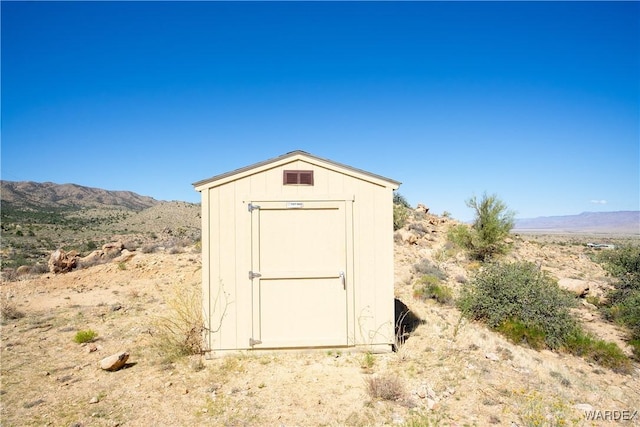 view of shed with a mountain view