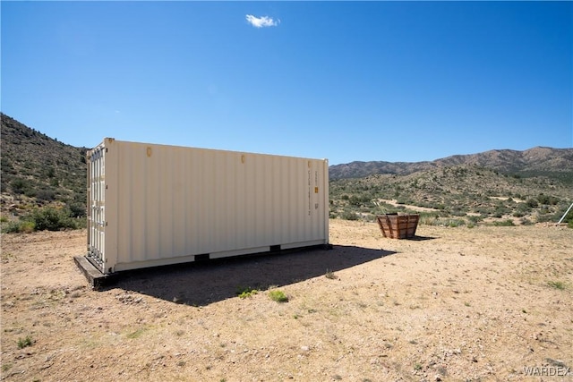 view of outbuilding with a mountain view