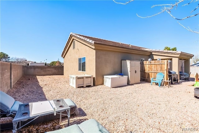 view of property exterior featuring a fenced backyard and stucco siding