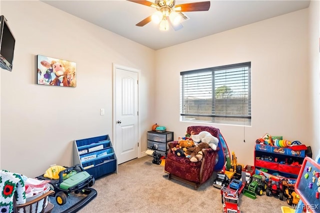 rec room with carpet floors and a ceiling fan