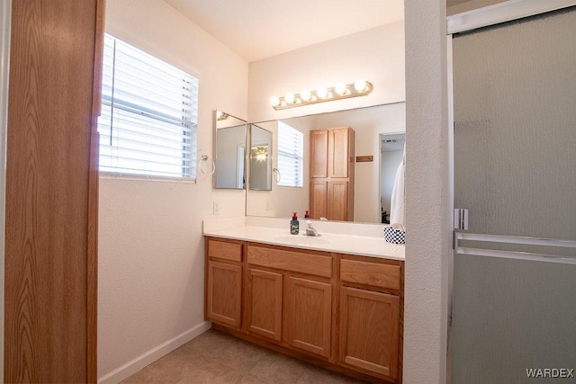bathroom with tile patterned floors and vanity