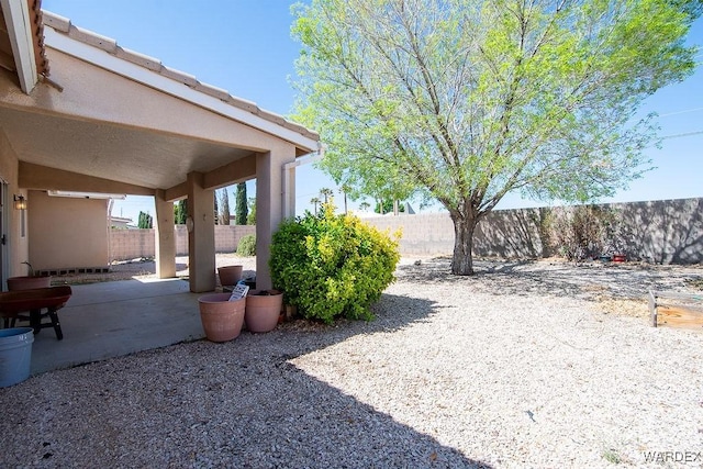 view of yard featuring a fenced backyard and a patio