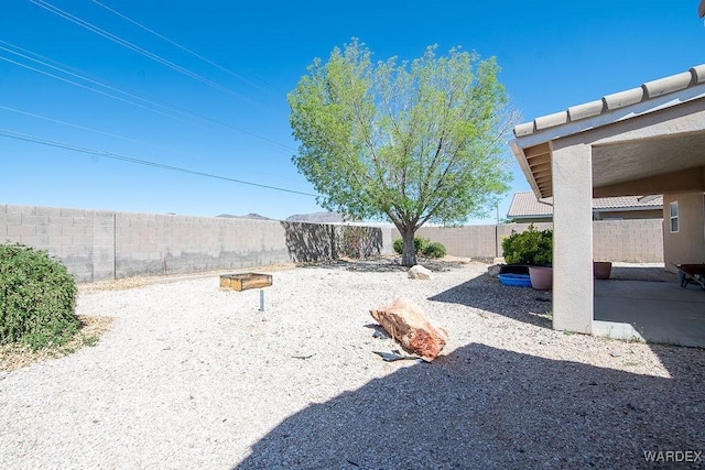 view of yard featuring a fenced backyard and a patio area