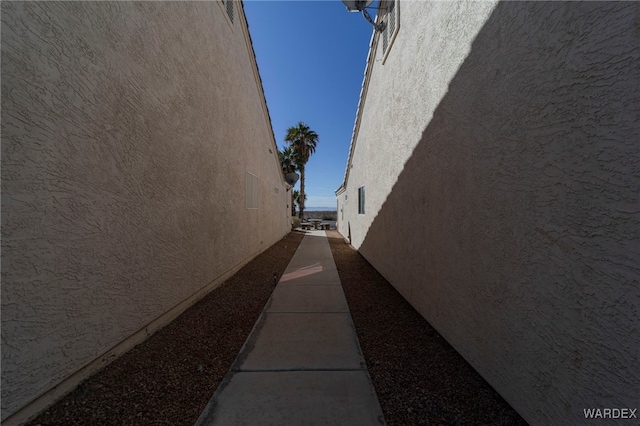 view of side of home with stucco siding