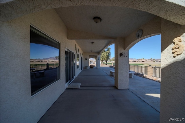 view of patio / terrace featuring fence