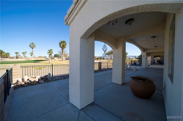 view of patio / terrace featuring fence