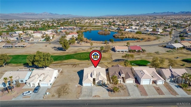 aerial view featuring a residential view and a water and mountain view